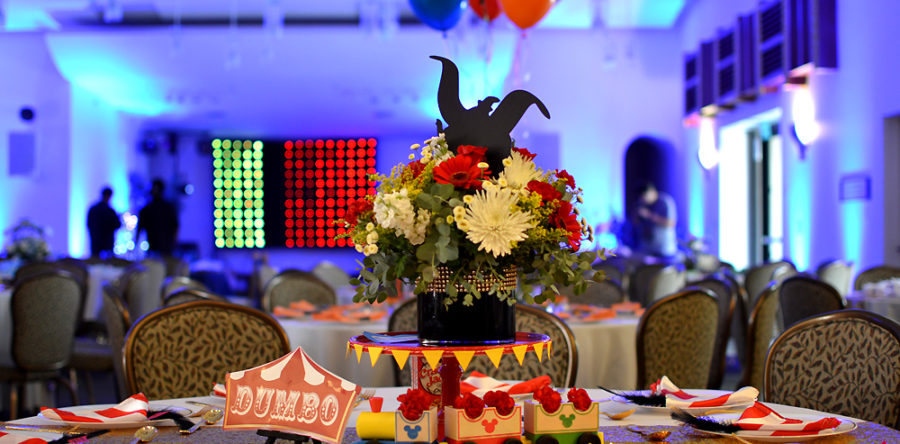 A table with flowers and decorations on it.