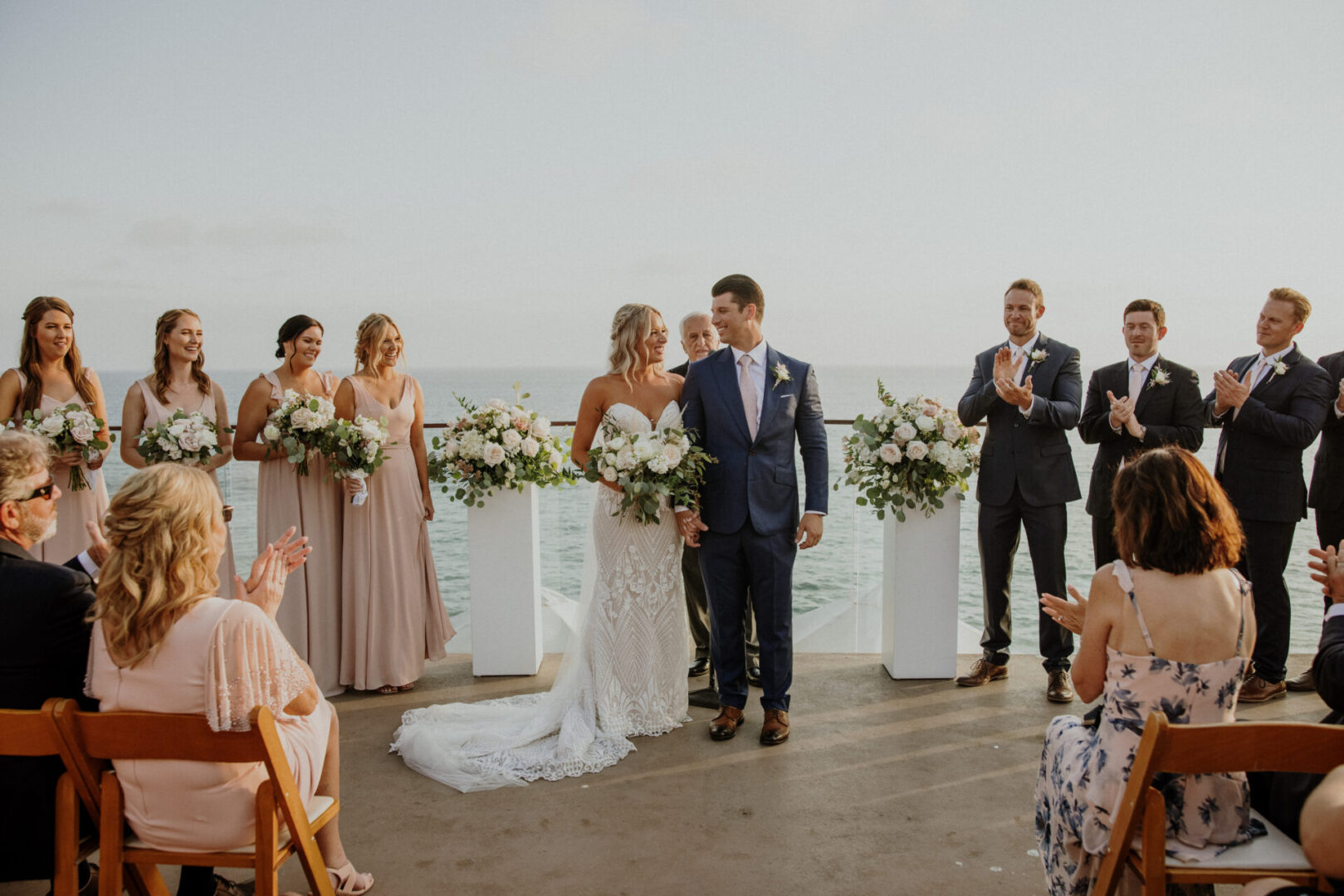 A couple is walking down the aisle at their wedding.