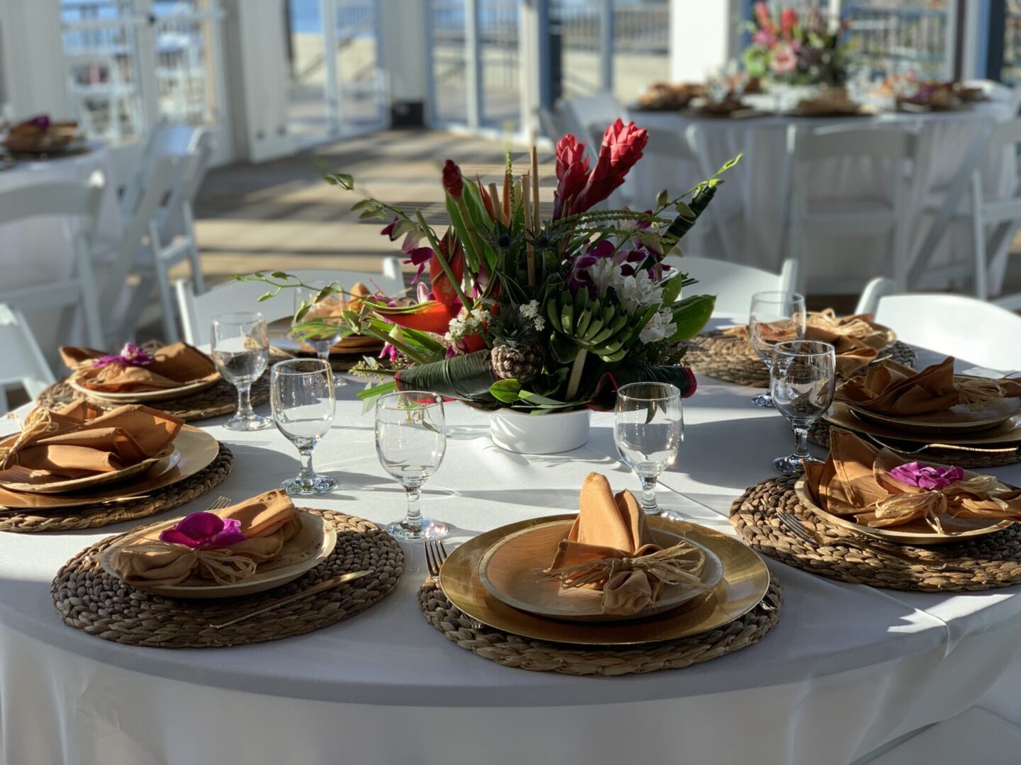 A table set with plates and glasses for a party.