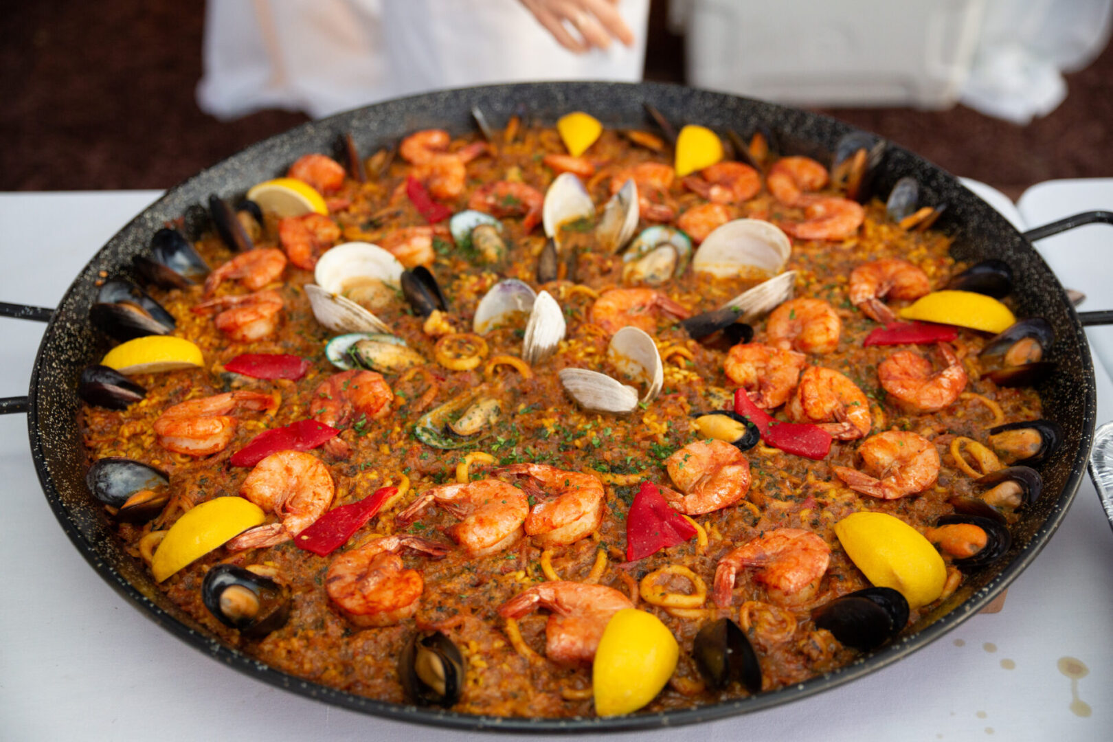 A pan of food with shrimp and clams.