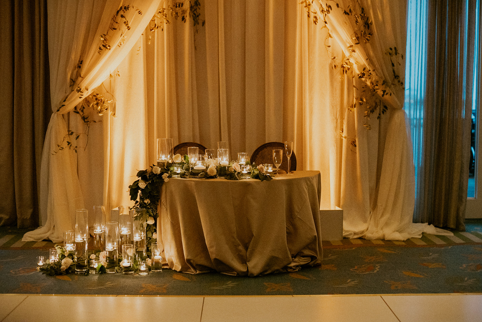 A table with candles and flowers on it