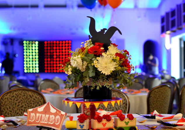 A table with flowers and decorations on it.